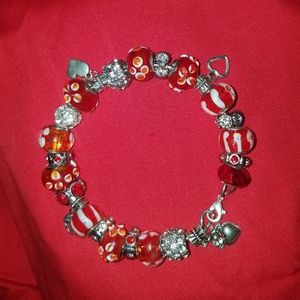 A red murano charm bracelet